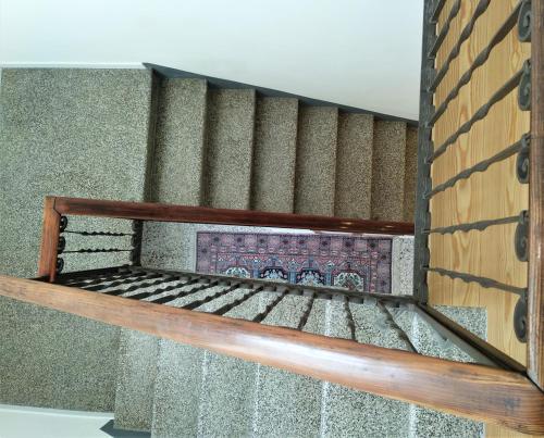 a wooden bunk bed in a room with stairs at Residenza Laurum in Mandello del Lario