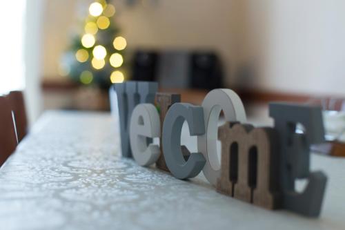 a close up of the word act spelled in wooden letters at Campi Flegrei House in Naples