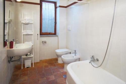 a bathroom with a sink and a toilet and a sink at Villa Di Papa' in Gaeta