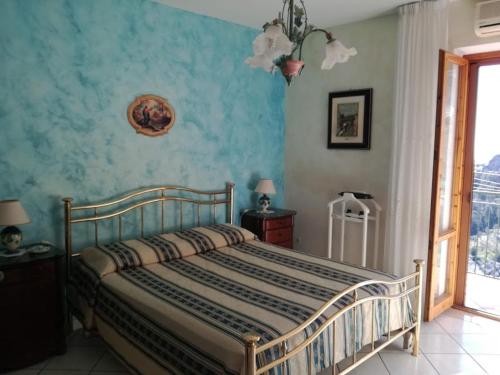 a bedroom with a bed and a dresser at Domus Gaia in Amalfi