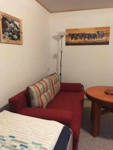 a living room with a couch and a table at Zum Stadtwald in Spremberg