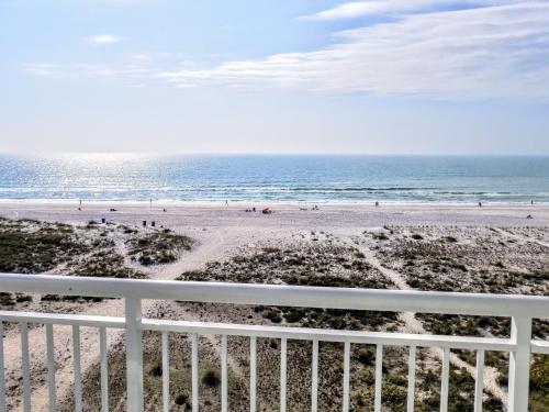 a view of the beach from the balcony of a condo at Provident Oceana Beachfront Suites in St Pete Beach