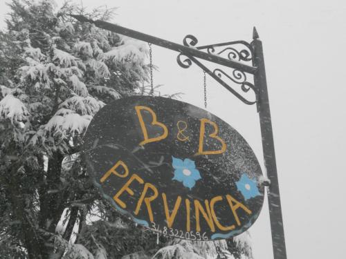 a sign that says bc fencing in the snow at B&B Pervinca in Rocca Grimalda