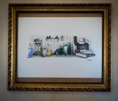a drawing of a kitchen in a picture frame at Memórias Charme Residences in Covilhã