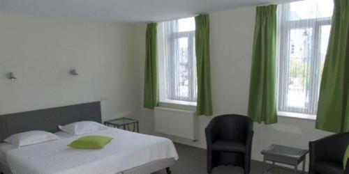 Postel nebo postele na pokoji v ubytování Well'in Hotel