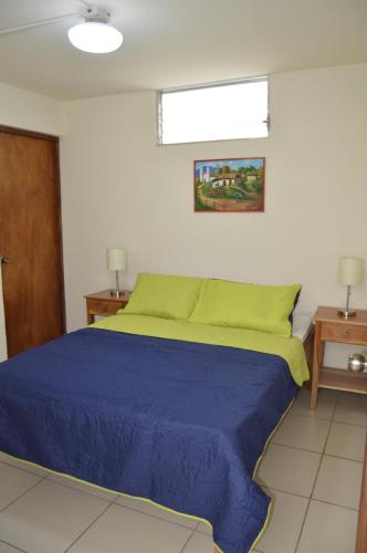 Ліжко або ліжка в номері Hostal Libertad