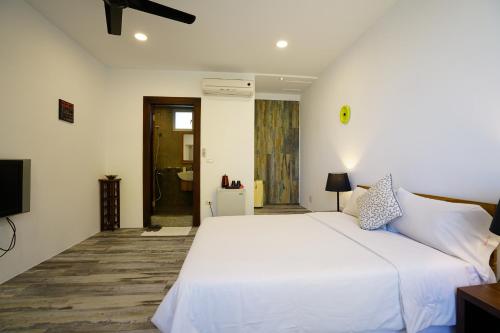 Ένα ή περισσότερα κρεβάτια σε δωμάτιο στο Summer Ya B&B