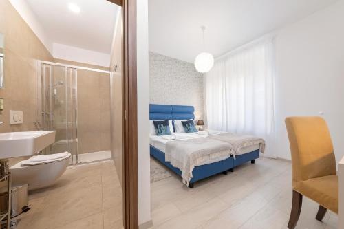 מיטה או מיטות בחדר ב-San Martino Rooms