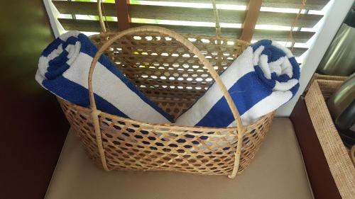 a basket on a window sill with towels in it at Sahaa Beach Resort in Sihanoukville