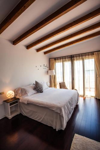 Ένα ή περισσότερα κρεβάτια σε δωμάτιο στο Summer Ya B&B