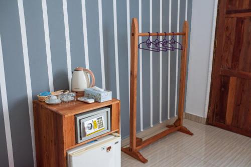 a small tv sitting on top of a table at Mocco Beach Villa in Kendwa