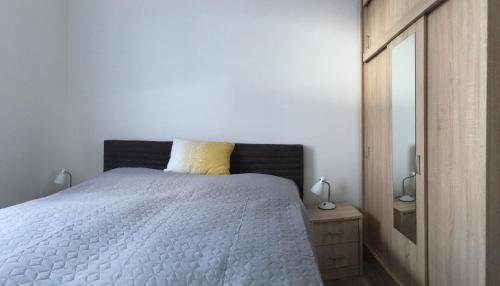 מיטה או מיטות בחדר ב-Apartmán Smokovec