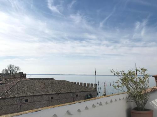 a view of the water from the roof of a building at Lacisivm Lake View in Lazise
