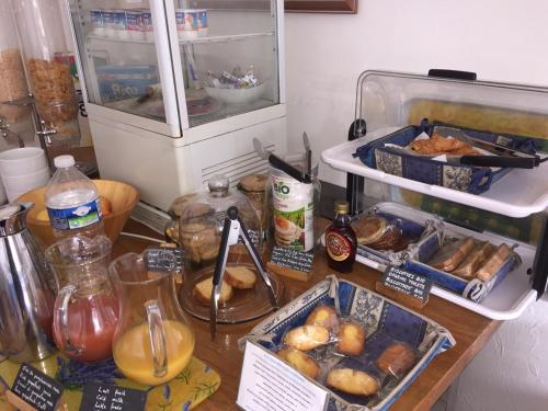 a counter with a bunch of food on it at Hotel Cayrons Vence & St Paul de Vence in Vence