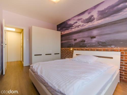 Posteľ alebo postele v izbe v ubytovaní Apartament Wakacyjny z tarasem