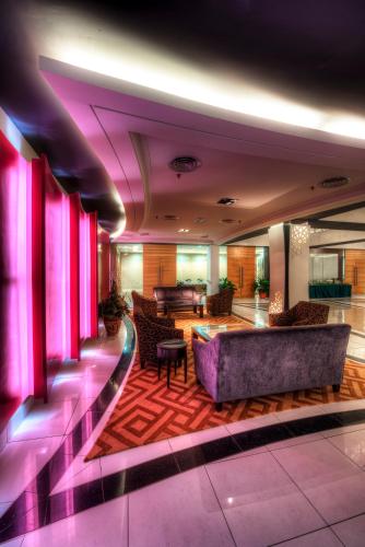 a lobby of a hotel with purple lighting at Raia Hotel Kota Kinabalu in Kota Kinabalu
