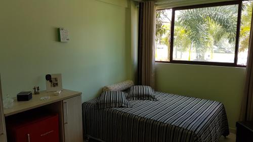 מיטה או מיטות בחדר ב-Beach Class Eco Life Figueira