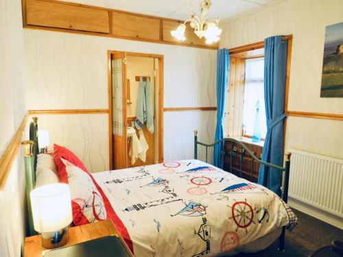 Ένα ή περισσότερα κρεβάτια σε δωμάτιο στο Windhaven Camping and B&B