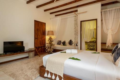 Cama o camas de una habitación en Bliss Hotel Praslin
