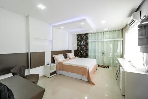 Postel nebo postele na pokoji v ubytování Xique Xique Palace Hotel