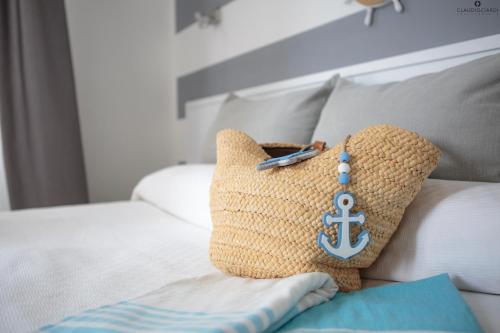 a pillow with an anchor on it sitting on a couch at L'Approdo Dell'Ammiraglio in La Spezia