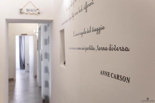 a hallway of a room with writing on the wall at L'Approdo Dell'Ammiraglio in La Spezia