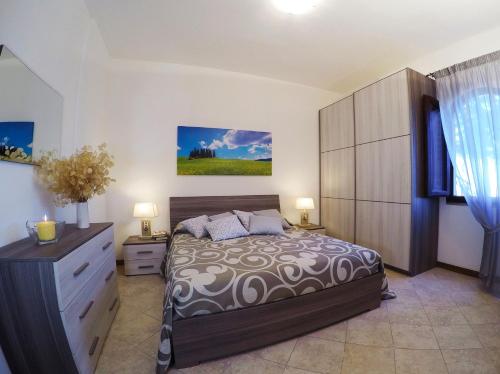 Łóżko lub łóżka w pokoju w obiekcie La Tuia
