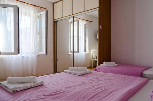 מיטה או מיטות בחדר ב-Apartmani Marko