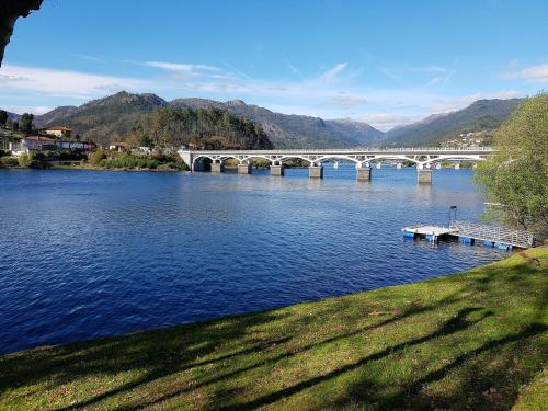 a bridge over a river with a bridge at Vivenda do Paúl in Geres