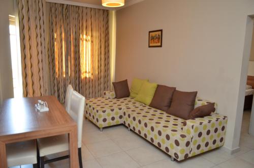 a living room with a couch and a table at Melissa Moment Apart in Kemer