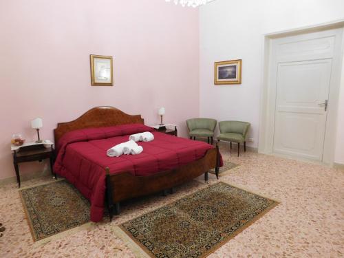 Ένα ή περισσότερα κρεβάτια σε δωμάτιο στο Appartamento Belvedere