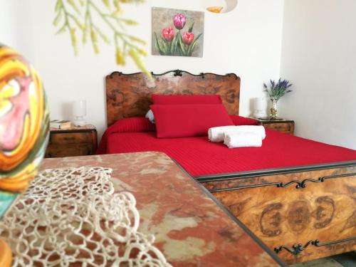 En eller flere senge i et værelse på Appartamento La Pinetina