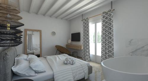 una camera bianca con letto e vasca di Apiro Mykonos a Mykonos Città
