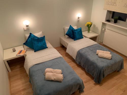 Ліжко або ліжка в номері Ilmarine Apartment