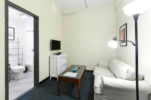 a living room with a couch and a table at Temple Place 6th Floor in Boston