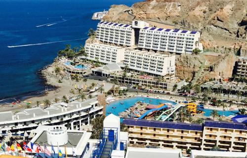 an aerial view of a resort with a swimming pool at apartmant Adrian Vista Taurito in Taurito