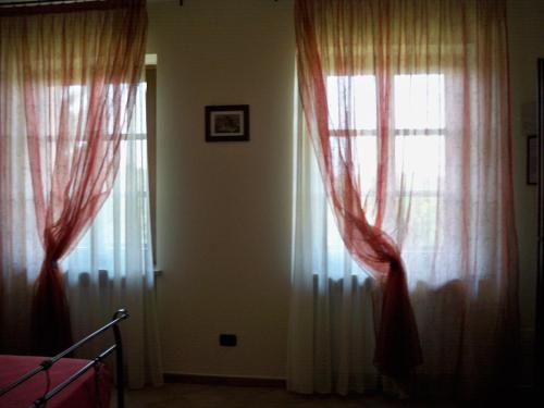 Postel nebo postele na pokoji v ubytování Cascina La Corte