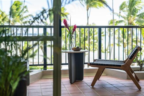 a chair sitting on a balcony with a table at Shangri-La Yanuca Island, Fiji in Voua