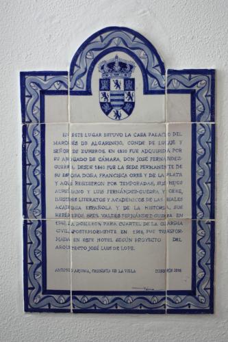a blue and white sign hanging on a wall at Hotel Zuhayra in Zuheros