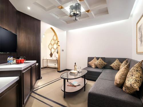 a living room with a couch and a table at Summit Hotel Magnolia in Manila
