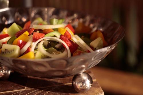 a salad in a glass bowl on a table at Phi Phi CoCo Beach Resort in Phi Phi Don