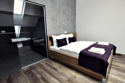 Ένα ή περισσότερα κρεβάτια σε δωμάτιο στο Apartments The Art House