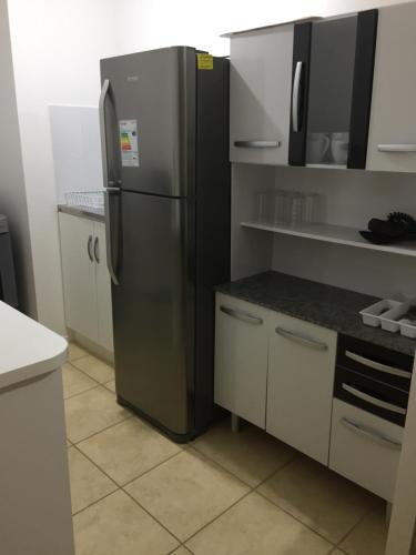 a kitchen with a stainless steel refrigerator at Departamento Quilpué in Quilpué