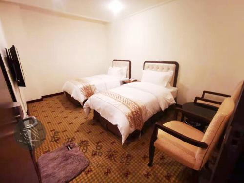 Postel nebo postele na pokoji v ubytování Chang Hong Hotel