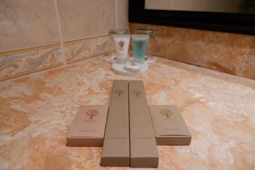 two certificates sitting on top of a tiled floor at Parkview Hotel in Kampong Jerudong