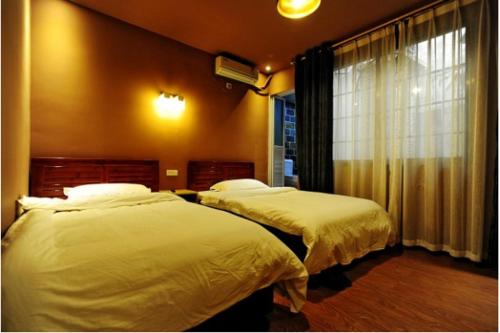 Postel nebo postele na pokoji v ubytování Shu Hostel