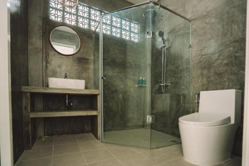 a bathroom with a shower and a toilet and a sink at IAMSAIGON homestay in Ho Chi Minh City