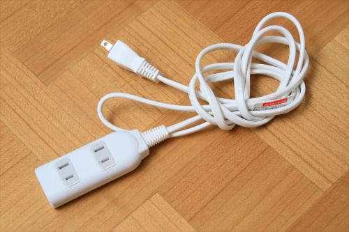 a white electronic device sitting on a wooden table at Bay Hotel Urayasu-ekimae in Urayasu