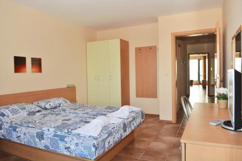 A bed or beds in a room at The Heart of Sunny Beach