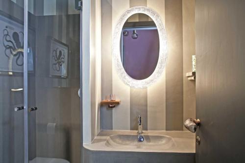 a bathroom with a sink and a mirror at Porcellino Gallery Art Boutique BB in Florence